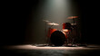 © KunFhayakun - Dramatic spotlight illuminates a drum kit, evoking musical performance atmosphere