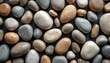 © Viktor - Bird-eye view of smooth river rocks. Pebbles of various shapes, sizes, colors. Stone background, natural material. Zen-like composition. Abstract pebble pattern. Perfect for zen meditation, spa
