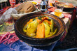 © Paweł Michałowski - Berber Moroccan tagine dish. Hot lunch served. Traditional food plate. Colorful table setting. Spiced vegetables aroma. Cultural outdoor dining. Local taste moment. Authentic north africa cuisine.