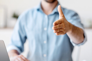 Poster - Partnership Offer. Confident Businessman Giving Hand For Handshake At Camera, Greeting Somebody In Office, Proposing Cooperation, Selective Focus