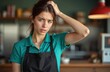 © Viktor - Worried woman fast food worker, touches head. Overwhelmed employee stressed, overworked at eatery. Unhappy seller at retail store, problem with schedule, work fatigue.