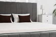 © Pixel-Shot - New orthopedic mattress on stylish bed in room