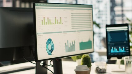 Poster - financial charts and kpi metrics on displays in office, panning shot. vibrant and collaborative mode