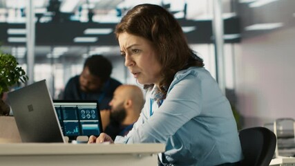 Poster - Upset employee in office dejected by bad news after reading negative email from business partner. Dejected worker frowning after failed client acquisition attempt, camera A