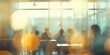 © Kartika - A blurry image of a group of people sitting at tables in a restaurant
