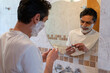 © Claudia Ramírez - Happy Latino man wearing a white t-shirt preparing his razor to shave his beard in the morning