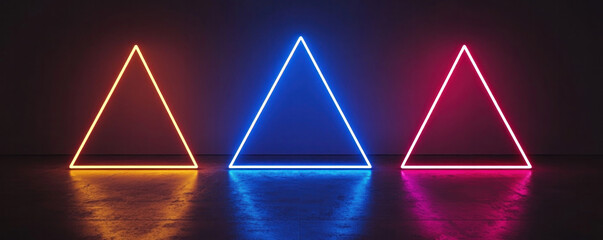 Poster - Three neon colored triangles are lit up in a dark room. The colors are orange, blue, and pink. The triangles are arranged in a row, with the pink one on the right, the blue one in the middle