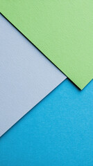 Poster - A blue, green, and gray piece of paper with a patterned texture. The colors are vibrant and the texture is interesting