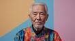 © sevenSkies - chinese elderly man on colorful plain bright background modern chic fashion pose  model portrait  portrait banner with copy space ad concept marketing