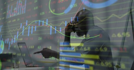 Poster - Analyzing financial graphs on laptop, businessman working on data projections
