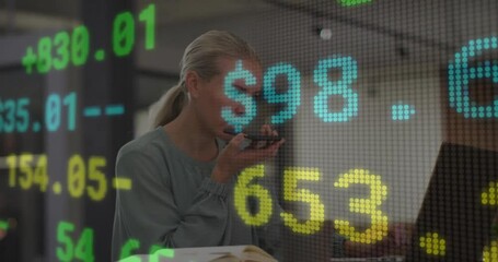 Poster - Businesswoman speaking into phone with stock market data animation overlay