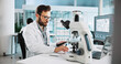 © peopleimages.com - Microscope, science and clipboard with man in laboratory for tissue sample, cancer research and healthcare. Cell treatment, report and medical test with person in clinic for tumor enzyme and record