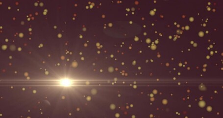 Poster - Animation of glowing particles floating over bright light burst on dark background