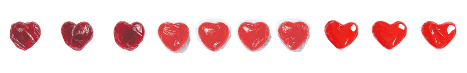 Aufkleber - Delicate composition of isolated red heart-shaped candies on a minimalist white background