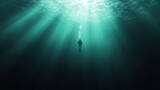 Diver under water with sunlight