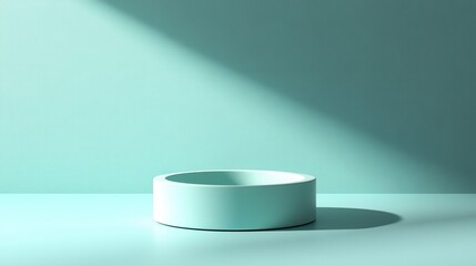Poster - A minimalistic scene featuring a round, light-colored bowl on a soft turquoise surface, illuminated by a gentle shadow.