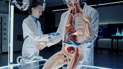 Leinwandbilder - Medical training session showcasing human anatomy model in a modern laboratory environment