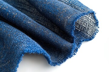 Aufkleber - Close-up of a textured, blue fabric with a slightly frayed edge, showcasing its woven details.