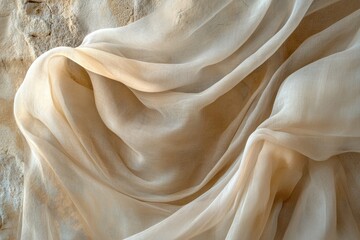 Leinwandbilder - Draped beige sheer fabric on a textured beige surface. Light and airy, elegant and flowing.