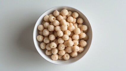 Poster - Aerial shot of crispy rice cereal in a white bowl. Overhead food photo.