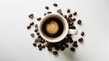 Beans and a coffee cup displayed on a white background.