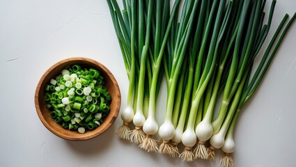 Aufkleber - Green onion placed in a wooden bowl on a white backdrop.
