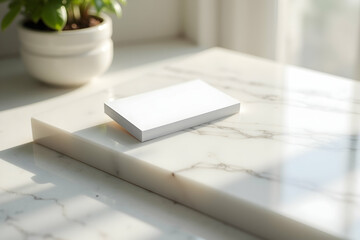 Poster - Elegant Minimalist Scene Featuring a Stack of White Cards on a Marble Slab with Soft Lighting, Perfect for Mockups and Design Presentations with a Clean Aesthetic