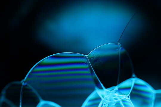 Blue liquid texture in macro, bright fluid background, smooth movement, molecular structure