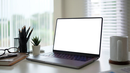 Aufkleber - Laptop with a blank display on a neatly arranged desk, ready for design or branding purposes.
