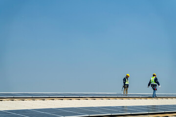 Wall Mural - team of professionals installs solar panels, ensuring energy efficiency and sustainable development.