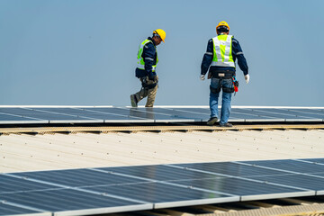 Wall Mural - team of professionals installs solar panels, ensuring energy efficiency and sustainable development.