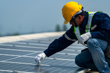 Wall Mural - two engineers install solar panels on a rooftop, wearing safety gear and helmets. the scene showcase