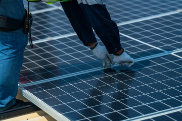 Wall Mural - team of professionals installs solar panels, ensuring energy efficiency and sustainable development.