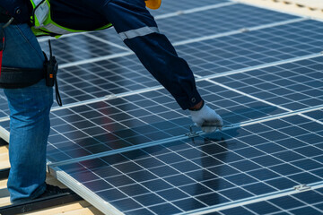 Wall Mural - team of professionals installs solar panels, ensuring energy efficiency and sustainable development.