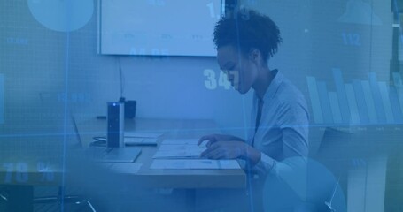 Poster - Businesswoman working at desk with financial data and graphs animation overlay