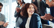 © BuyOutFelix01/peopleimages.com - Happy woman, teamwork and applause with promotion for congratulations, well done or good job at office. Female person, celebration and smile with colleagues clapping for success together at workplace