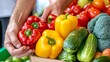 © Biggy - Fresh Colorful Vegetables in Hands at Market Stall Display
