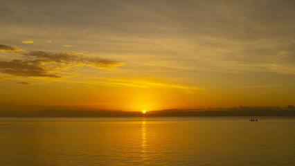 Wall Mural - stunning sunset over calm ocean waters