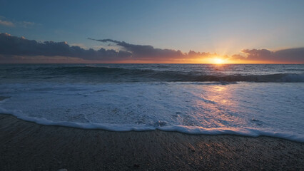 Wall Mural - sunset over sea with vibrant colors