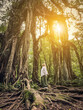 © tashka2000 - Woman near Giant Fig Tree in Bali Botanic Garden