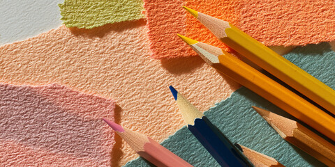 Poster - Colored pencils on textured pastel paper background, creating a vibrant and artistic scene, showcasing creativity and design, ideal for stationery or art concepts