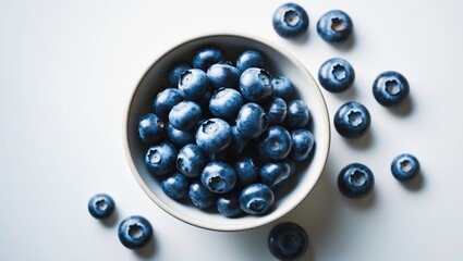 Aufkleber - Bowl containing fresh blueberries seen from the top against a white background