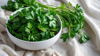 Poster - Bright green flat leaf parsley in a white bowl on linen fabric.