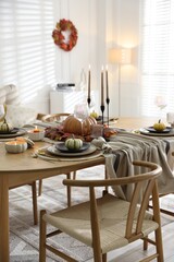 Poster - Stylish table setting with beautiful dishware and autumn decor in dining room