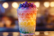 © ivlianna - Delightful bubble tea cup with vibrant multi-colored pearls at a cozy cafe during an evening outing