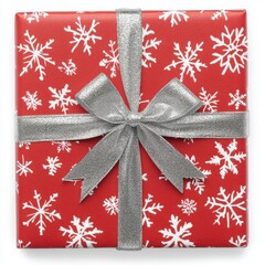 Wall Mural - Square gift wrapped in red with snowflakes and a silver ribbon bow on transparent background
