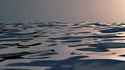 Poster - Gentle waves rippling across calm water surface, reflecting soft light from clear sky with subtle, fluid movement and metallic silver-blue tones