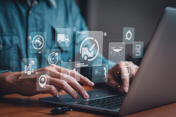 Aufkleber - Person using laptop with delivery and logistics icons floating above the keyboard and touchpad