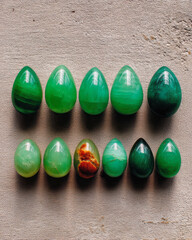 Poster - Arrangement of unique jade pieces displayed on textured surface for artistic inspiration