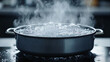 © Your Hand Please - Boiling water with bubbles and steam rising from a pot symbolizes transformation energy and purification representing change intensity and the essential role of heat in modern life.